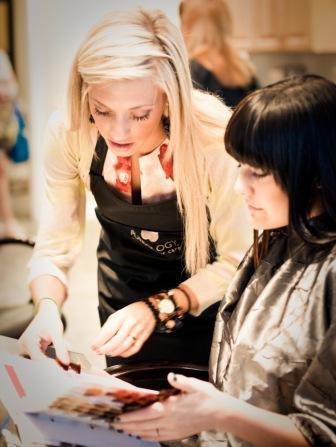 Image of a student enhancing the nails of a model with filing, shaping, cuticle care, a relaxing massage and polish